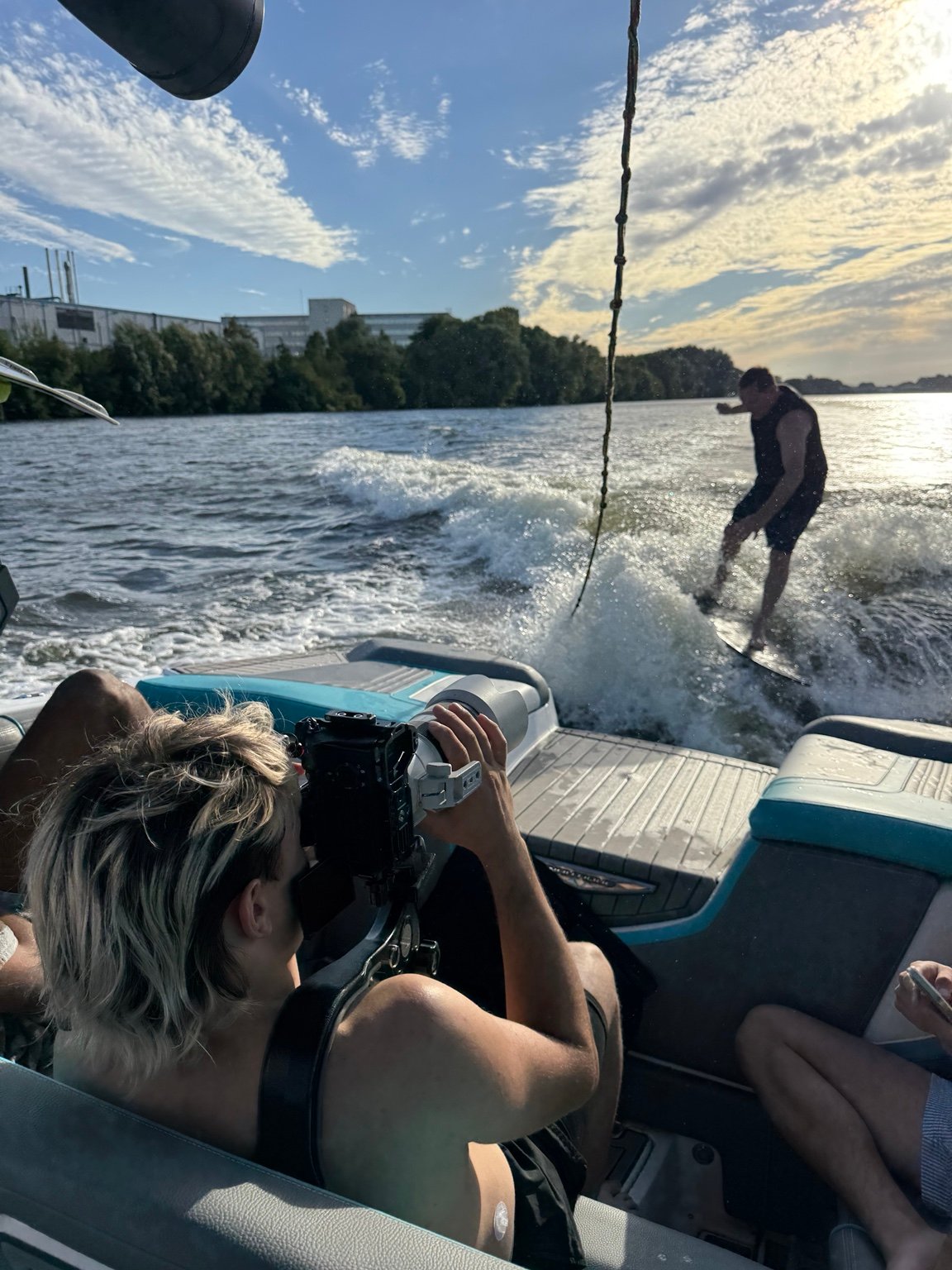 Filming a wakeboarding session from a boat